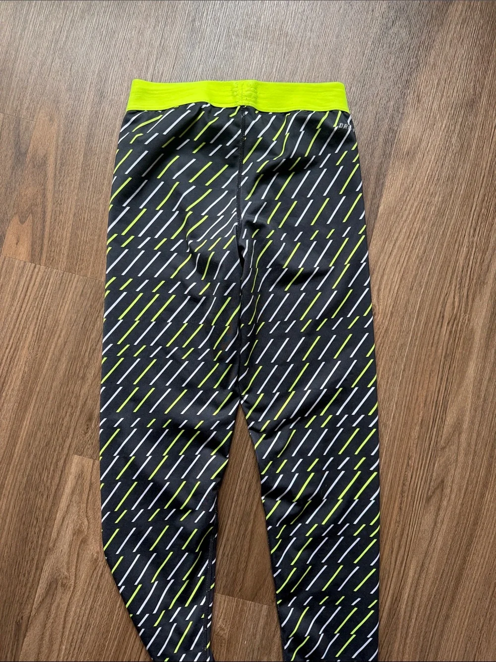 Nike Black Leggings with Neon Yellow and White Dash Pattern